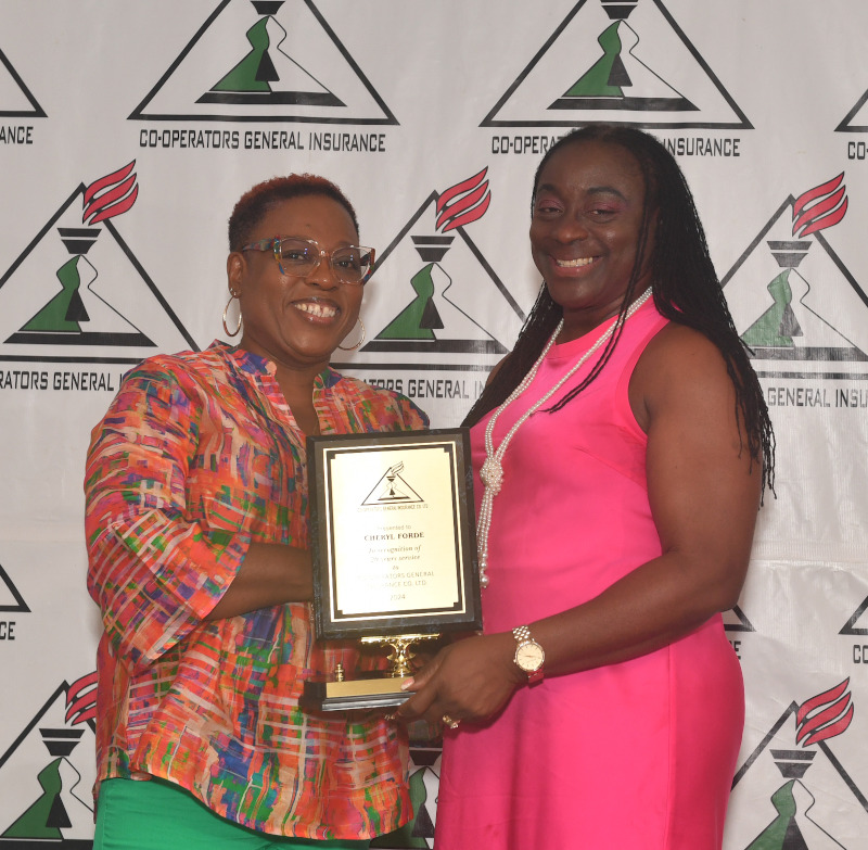 Cheryl Forde (right) being presented by director